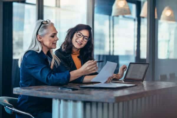 two women discussing strategy