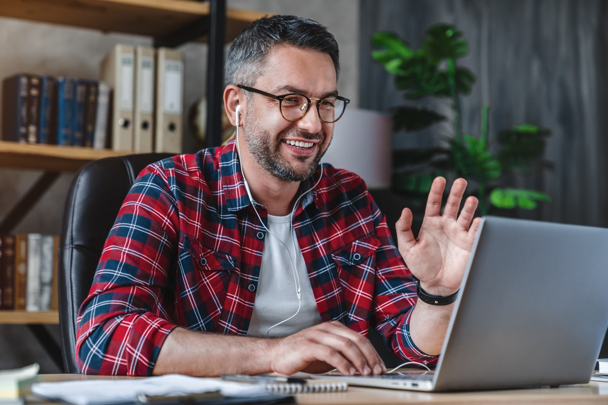 man participating in a virtual mentoring meeting