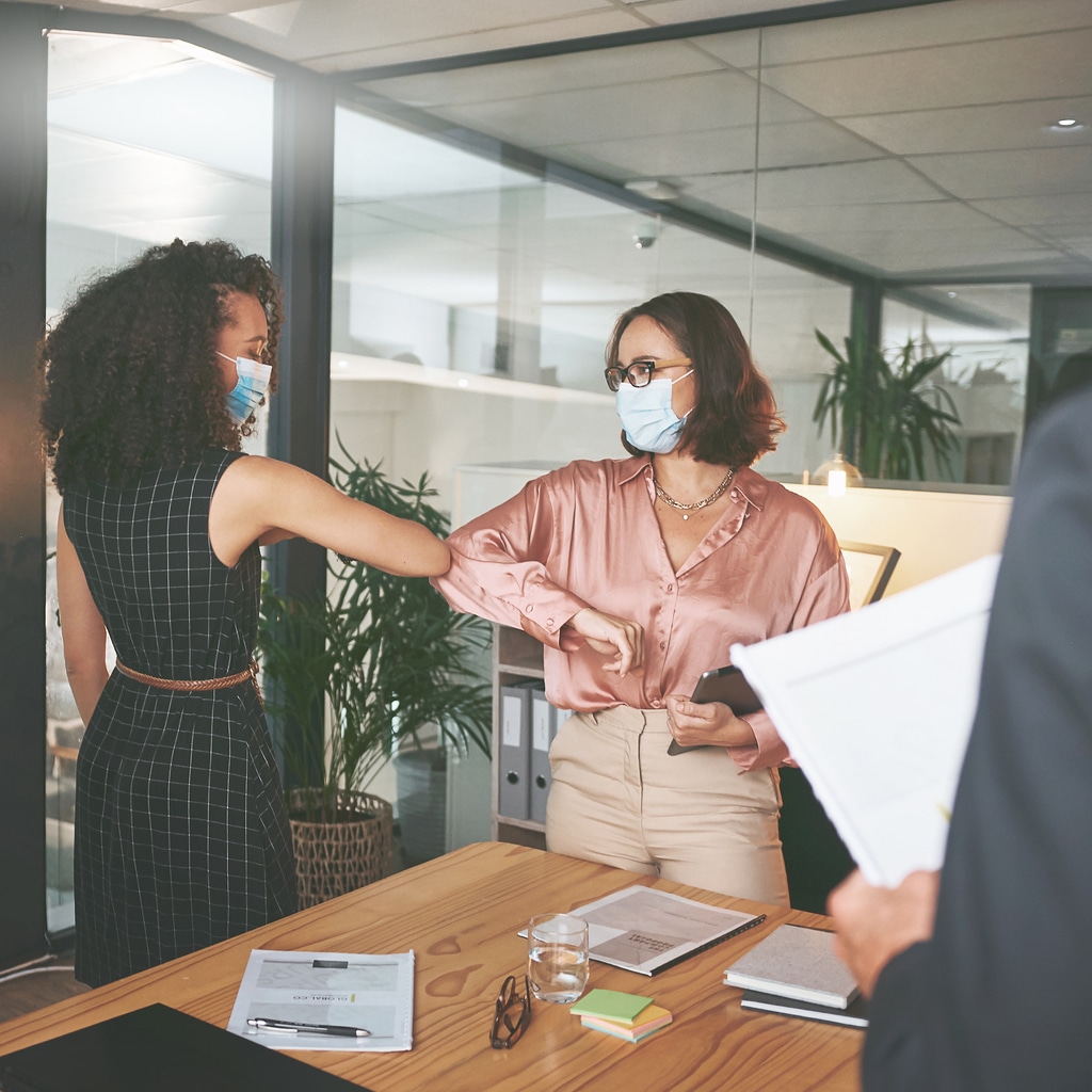 two women working together with shared purpose