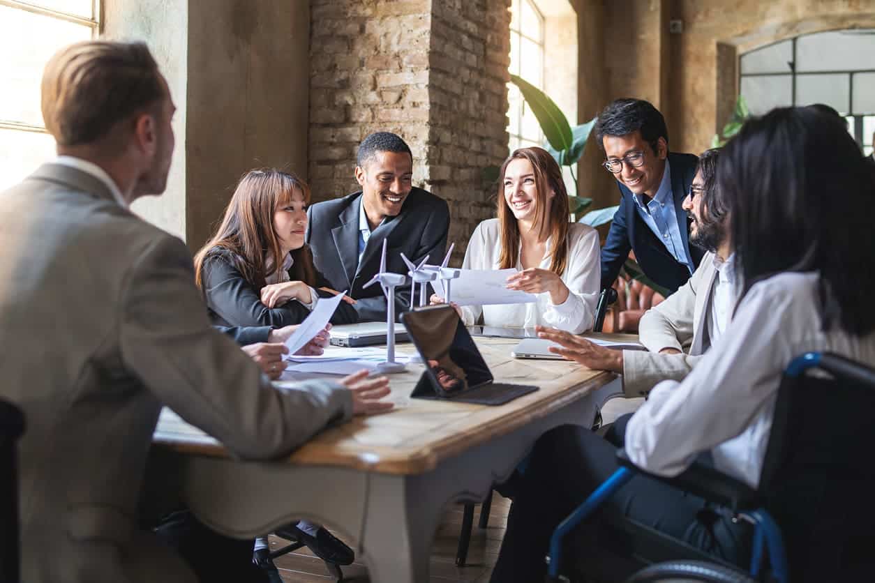 people discussing project around table