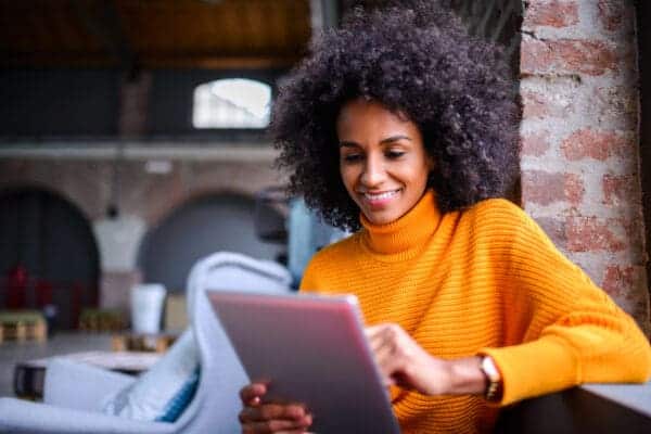 woman browsing community on tablet