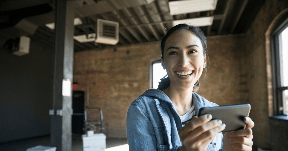 Woman laughs at an email subject line