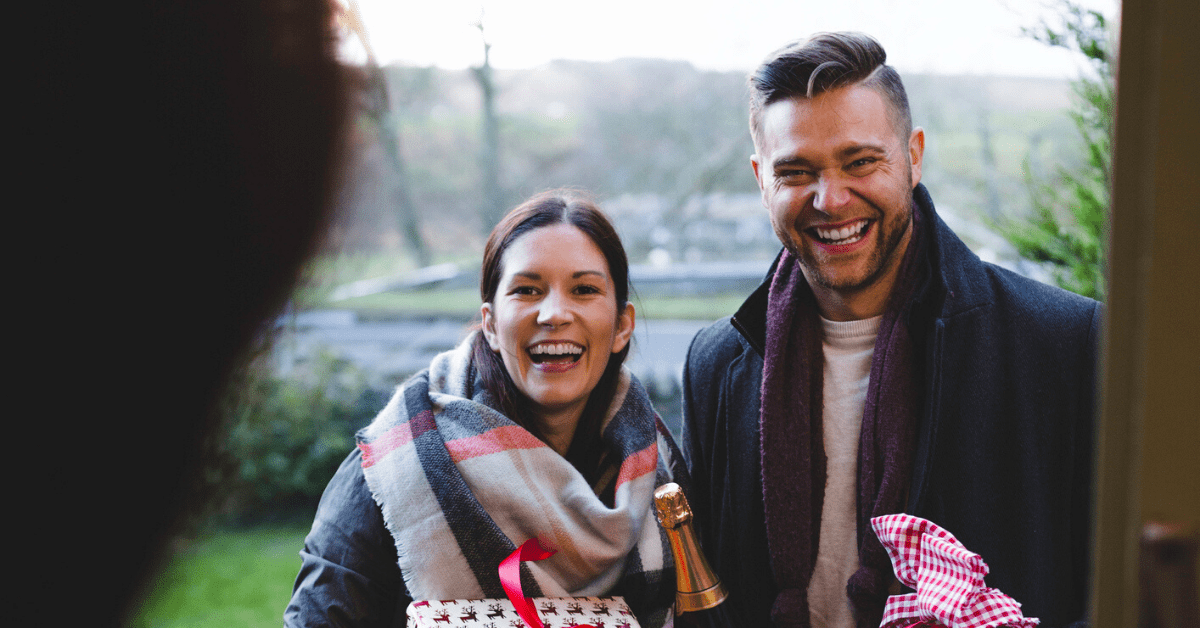 Host welcomes guests to party